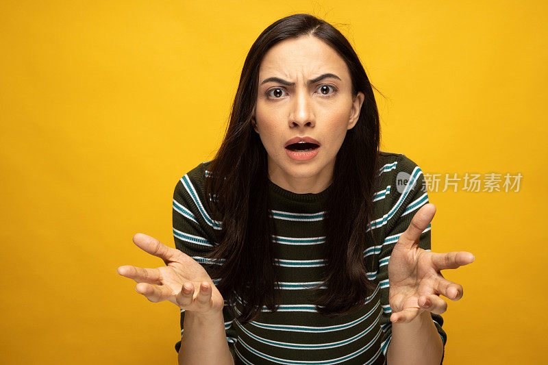 Photo of young women in wear t-shirt standing on yellow background stock photo